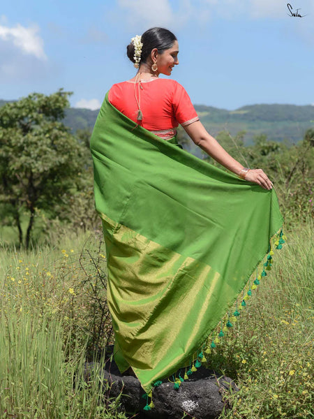 Elegant green and gold half-and-half saree with Gota patti lace