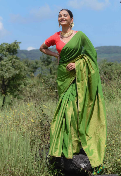 Elegant green and gold half-and-half saree with Gota patti lace