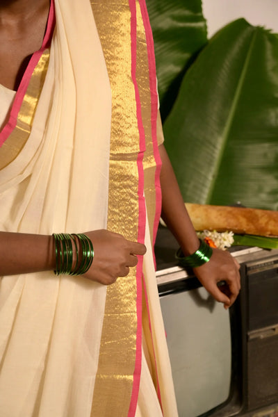 Off white mul cotton handwoven saree with golden and pink border