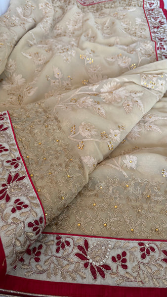 Sandy Off White Georgette Silk Saree with Red Border