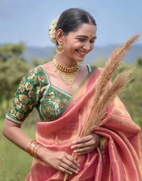 Elegant pink and gold half-and-half cotton-acrylic saree with zari-striped pallu