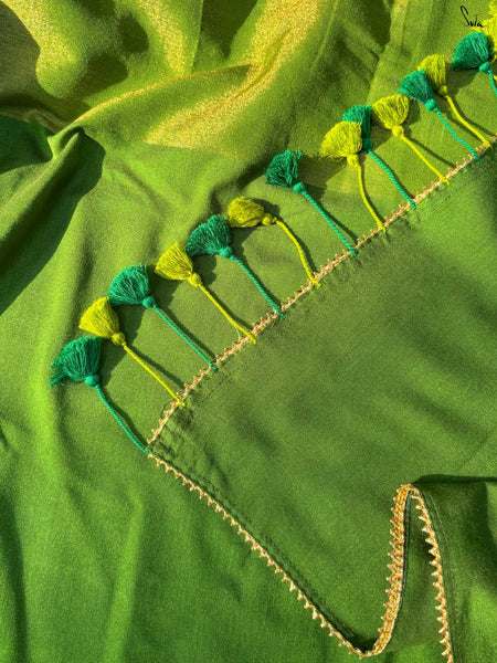 Elegant green and gold half-and-half saree with Gota patti lace