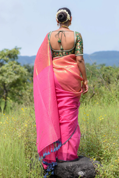 Elegant pink and gold half-and-half cotton-acrylic saree with zari-striped pallu