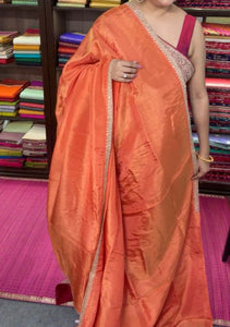 Orange Crepe Silk Saree with Zardosi Border