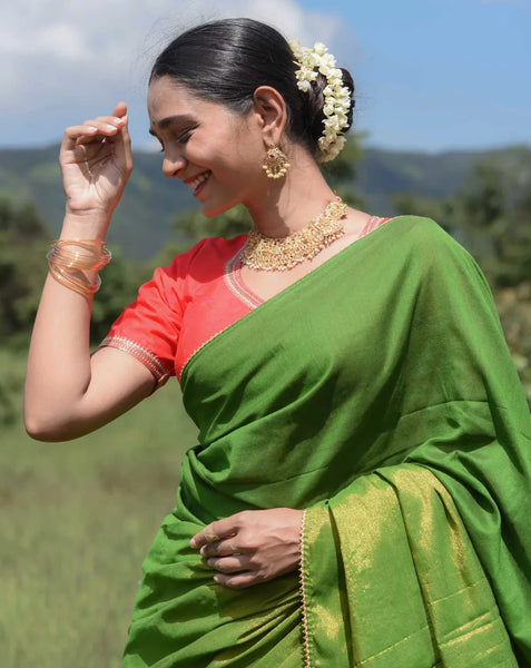 Elegant green and gold half-and-half saree with Gota patti lace