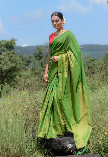 Elegant green and gold half-and-half saree with Gota patti lace