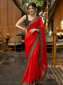 RED ORGANZA SAREE HIGHLIGHTED WITH BEAUTIFUL EMBROIDERED BORDER.