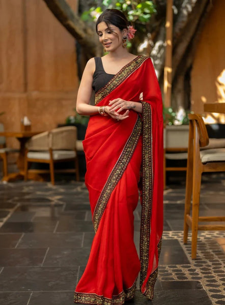 RED ORGANZA SAREE HIGHLIGHTED WITH BEAUTIFUL EMBROIDERED BORDER.