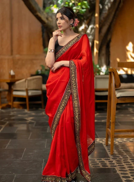 RED ORGANZA SAREE HIGHLIGHTED WITH BEAUTIFUL EMBROIDERED BORDER.