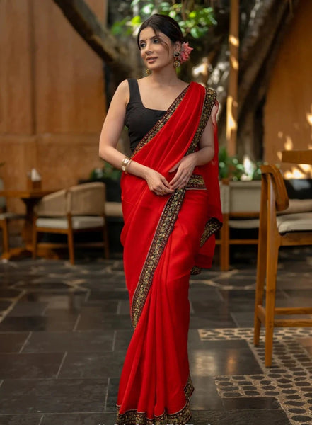 RED ORGANZA SAREE HIGHLIGHTED WITH BEAUTIFUL EMBROIDERED BORDER.