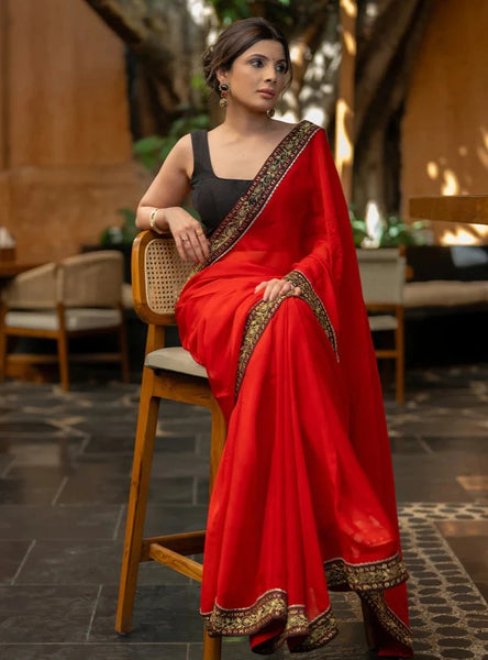 RED ORGANZA SAREE HIGHLIGHTED WITH BEAUTIFUL EMBROIDERED BORDER.