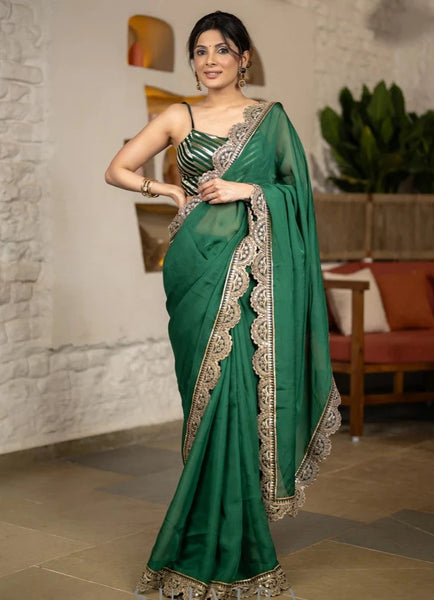 BOTTLE GREEN ORGANZA SAREE HIGHLIGHTED WITH MATCHING SCALLOPED LACE