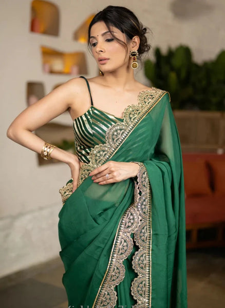 BOTTLE GREEN ORGANZA SAREE HIGHLIGHTED WITH MATCHING SCALLOPED LACE