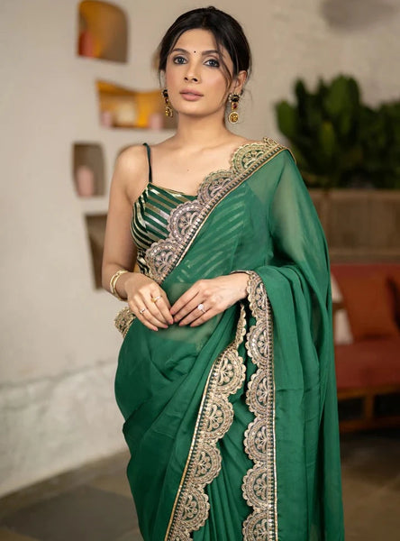 BOTTLE GREEN ORGANZA SAREE HIGHLIGHTED WITH MATCHING SCALLOPED LACE