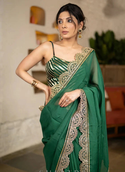 BOTTLE GREEN ORGANZA SAREE HIGHLIGHTED WITH MATCHING SCALLOPED LACE