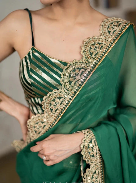 BOTTLE GREEN ORGANZA SAREE HIGHLIGHTED WITH MATCHING SCALLOPED LACE