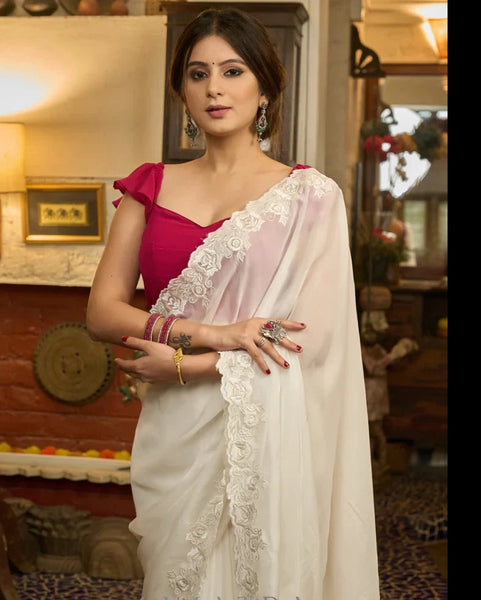 IVORY ORGANZA SAREE WITH FLORAL EMBROIDERY ON THE BORDER