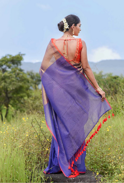 Half-and-half blue and gold zari saree with striped pallu
