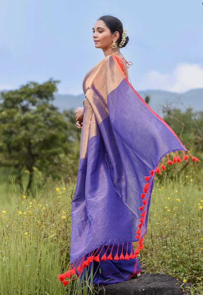 Half-and-half blue and gold zari saree with striped pallu