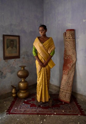 Mustard Handloom silk Jaal Banarasi Saree with floral Zari Border