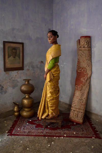Mustard Handloom silk Jaal Banarasi Saree with floral Zari Border