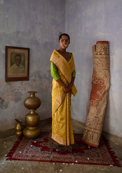 Mustard Handloom silk Jaal Banarasi Saree with floral Zari Border