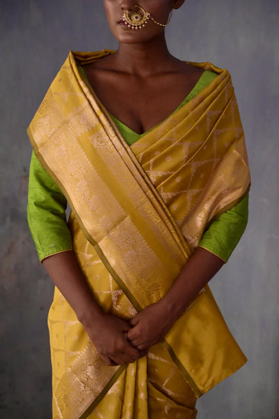 Mustard Handloom silk Jaal Banarasi Saree with floral Zari Border