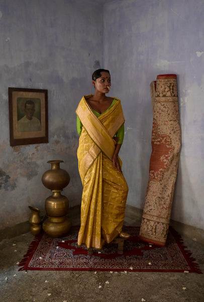Mustard Handloom silk Jaal Banarasi Saree with floral Zari Border