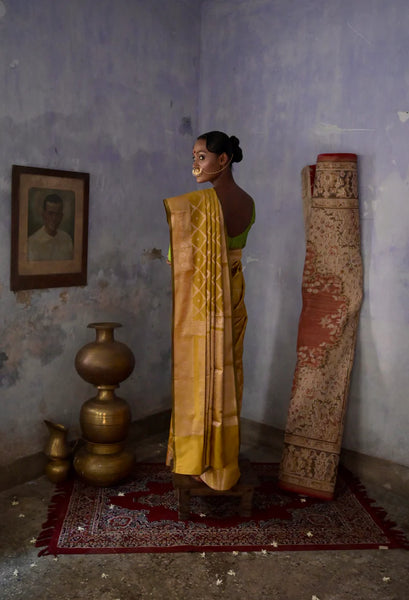 Mustard Handloom silk Jaal Banarasi Saree with floral Zari Border