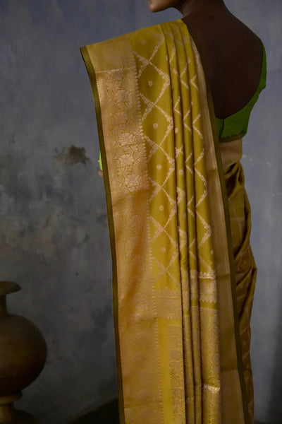 Mustard Handloom silk Jaal Banarasi Saree with floral Zari Border