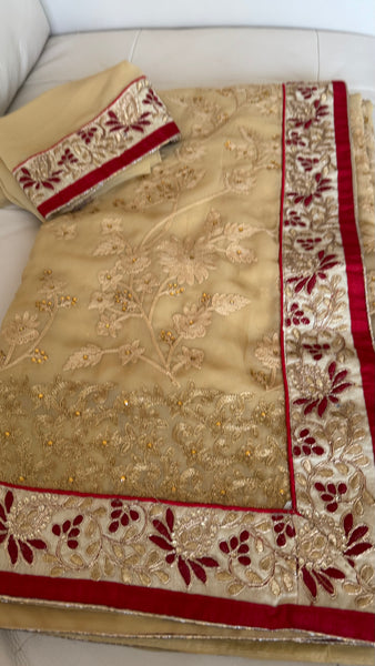 Sandy Off White Georgette Silk Saree with Red Border