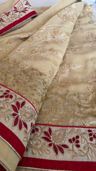 Sandy Off White Georgette Silk Saree with Red Border
