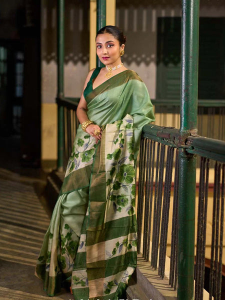 Green Tussar Silk Saree with Delicate Floral Artwork and Classic Border