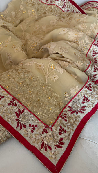 Sandy Off White Georgette Silk Saree with Red Border