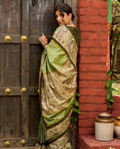 Pastel green semi-silk saree featuring Madhubani artwork on pallu and border