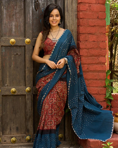 FUSION OF AJRAKH CHARM AND BANDHEJ FLAIR. RUST & TEAL COTTON SAREE