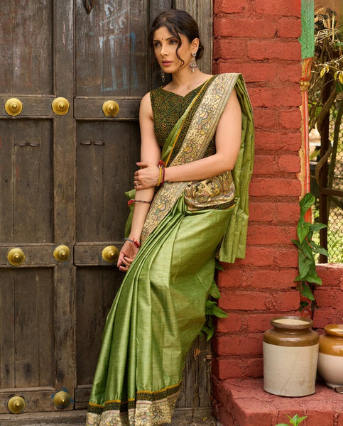 Pastel green semi-silk saree featuring Madhubani artwork on pallu and border