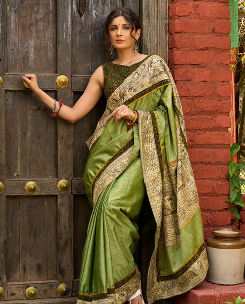 Pastel green semi-silk saree featuring Madhubani artwork on pallu and border