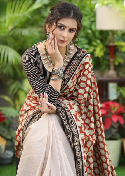 CREAM COTTON SAREE WITH PRINTED PALLU AND HIGHLIGHTED WITH AJRAKH BORDER