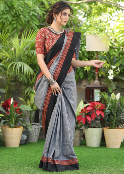 SLATE GREY COTTON SAREE WITH BEAUTIFUL AJRAKH LINES IN THE PALLU HIGHLIGHTED WITH BLACK BORDER
