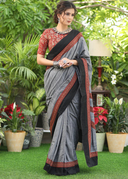 SLATE GREY COTTON SAREE WITH BEAUTIFUL AJRAKH LINES IN THE PALLU HIGHLIGHTED WITH BLACK BORDER