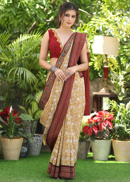 MUSTARD PRINTED COTTON SAREE ACCENTUATED WITH AJRAKH AND MIRROR BORDER