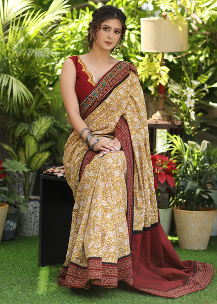 MUSTARD PRINTED COTTON SAREE ACCENTUATED WITH AJRAKH AND MIRROR BORDER