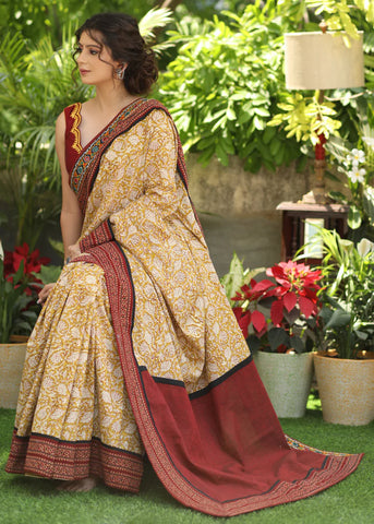 MUSTARD PRINTED COTTON SAREE ACCENTUATED WITH AJRAKH AND MIRROR BORDER