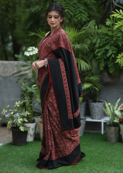 MAROON AJRAKH SAREE WITH BLACK BORDER & ACCENTUATED WITH STONE EMBELLISHMENT