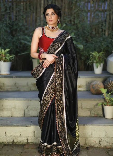 BLACK MODAL SILK SAREE WITH GOLDEN BORDER HIGHLIGHTED WITH LACE