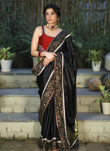 BLACK MODAL SILK SAREE WITH GOLDEN BORDER HIGHLIGHTED WITH LACE