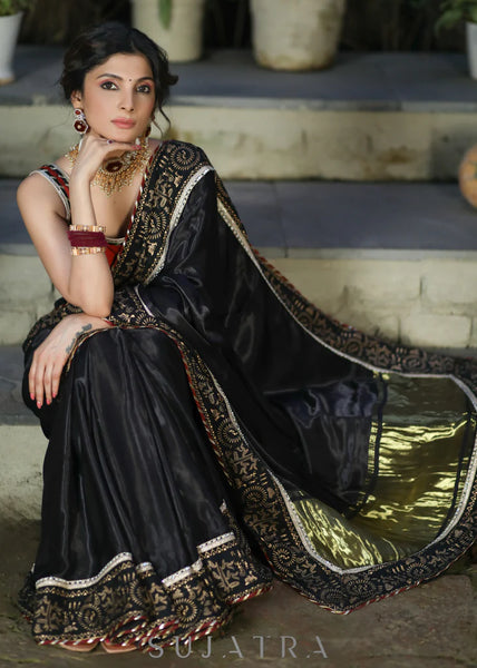 BLACK MODAL SILK SAREE WITH GOLDEN BORDER HIGHLIGHTED WITH LACE