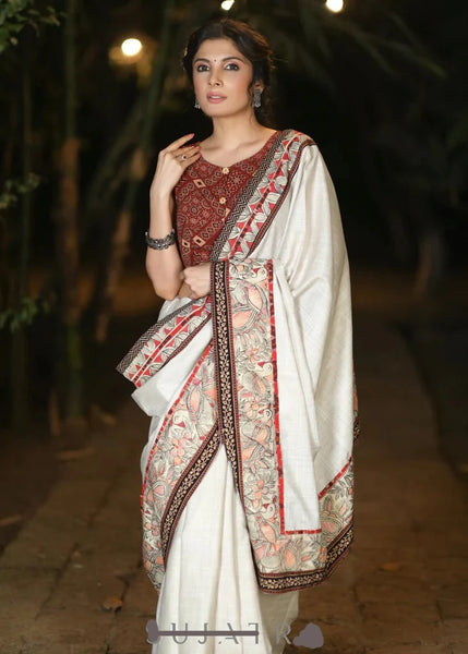 CREAM COTTON BLEND SAREE WITH HANDPAINTED MADHUBANI BORDER HIGHLIGHTED WITH AJRAKH DETAILING