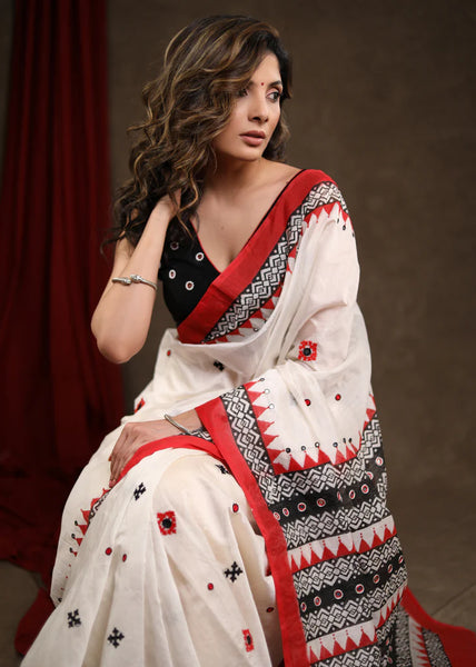 WHITE BLOCK PRINTED CHANDERI SAREE WITH TEMPLE BORDER & HAND EMBROIDERED GUJARATI STITCH